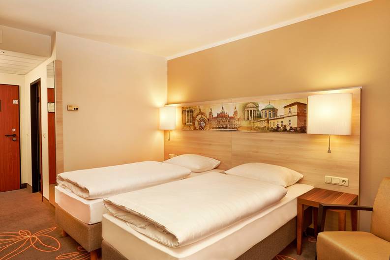 Aperçu de l‘une des chambres de l‘hôtel H+ Hotel Hannover - site internet officiel
