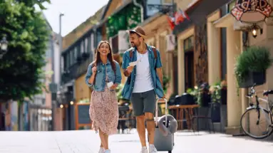 City Break - Offers at H-Hotels.com Couple walks along the street