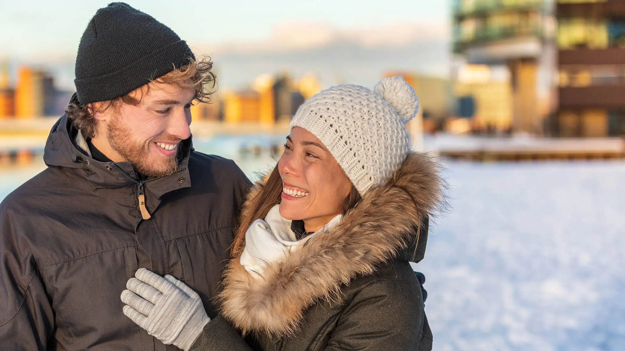 Couple is standing in Snow.