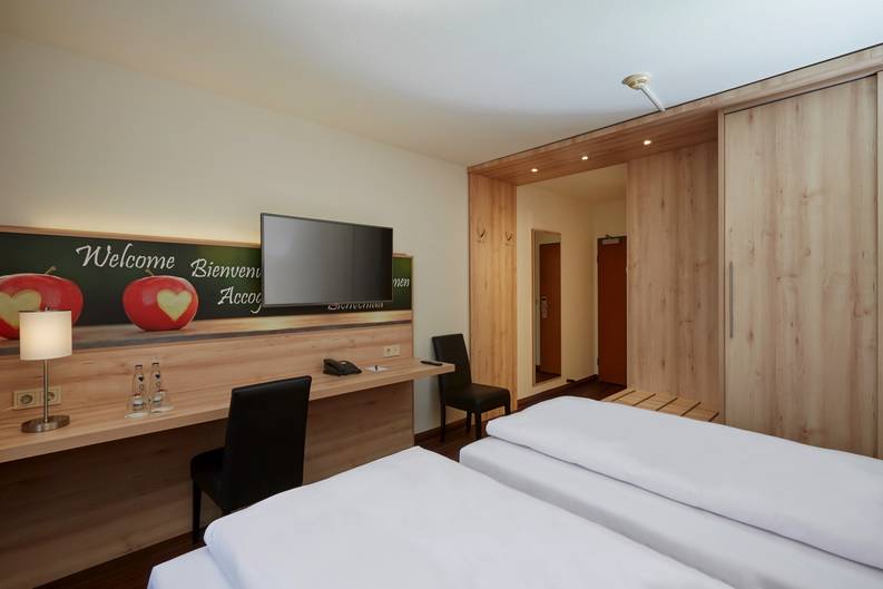 A modern hotel room at the H+ Hotel Stuttgart Herrenberg - Official website