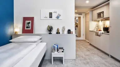 Appartamento H.ome Munich con angolo cottura e letto singolo.