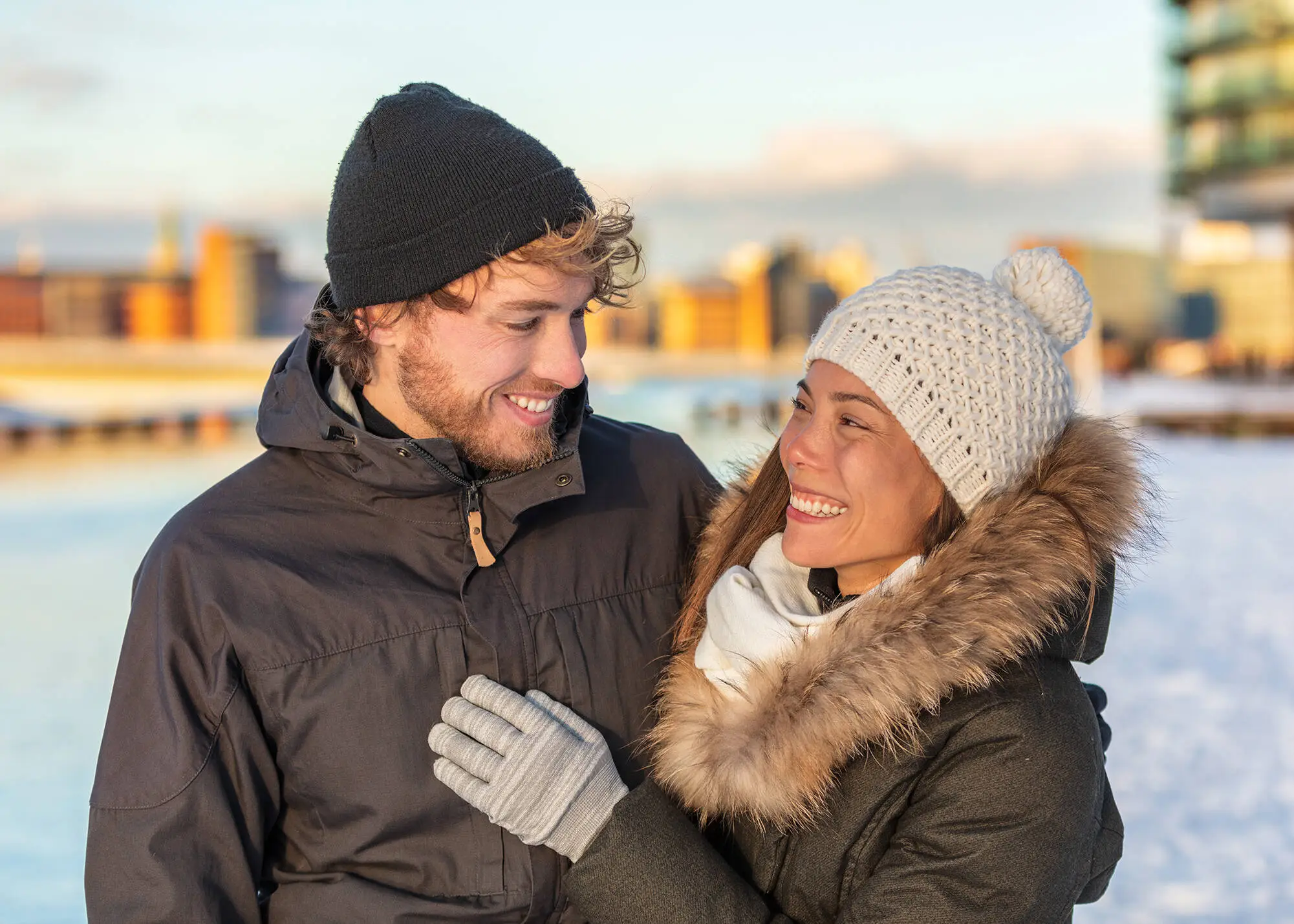 Couple is standing in Snow.
