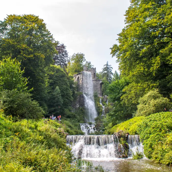 Waterfall in the greenery of Bergpark Wilhelmshöhe