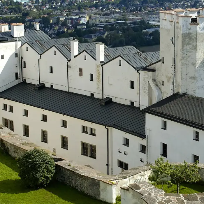 Sunny courtyard of Hohensalzburg Fortress with fountain