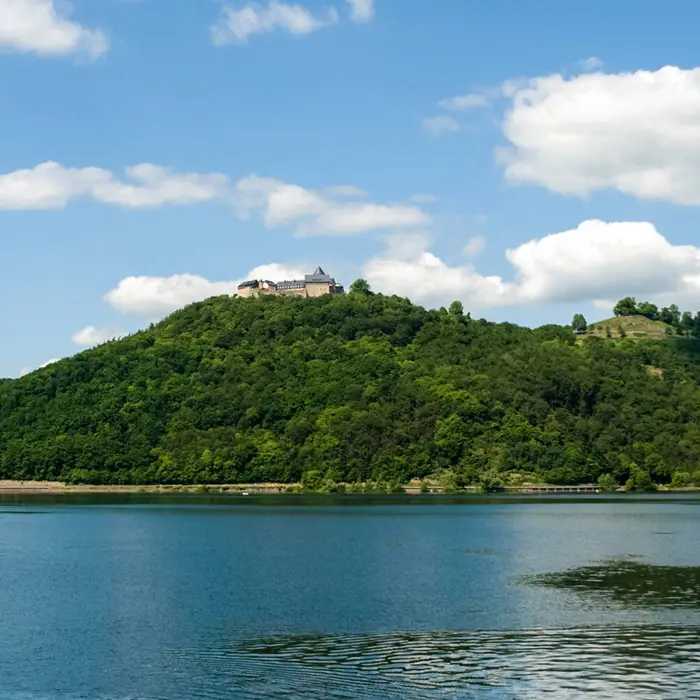 Lake Edersee with Waldeck Castle in the background on a mountain