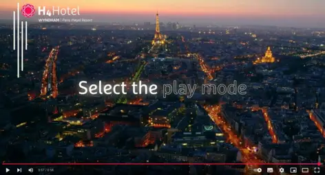 Still image from the hotel video with a view over Paris to the Eiffel Tower.