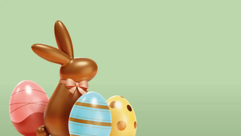 Osterhase mit Eiern auf grünem Hintergrund