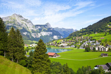 View of the valley in Engelberg with a lake.