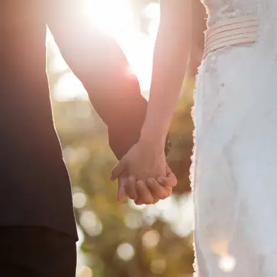 Wedding couple holding hands