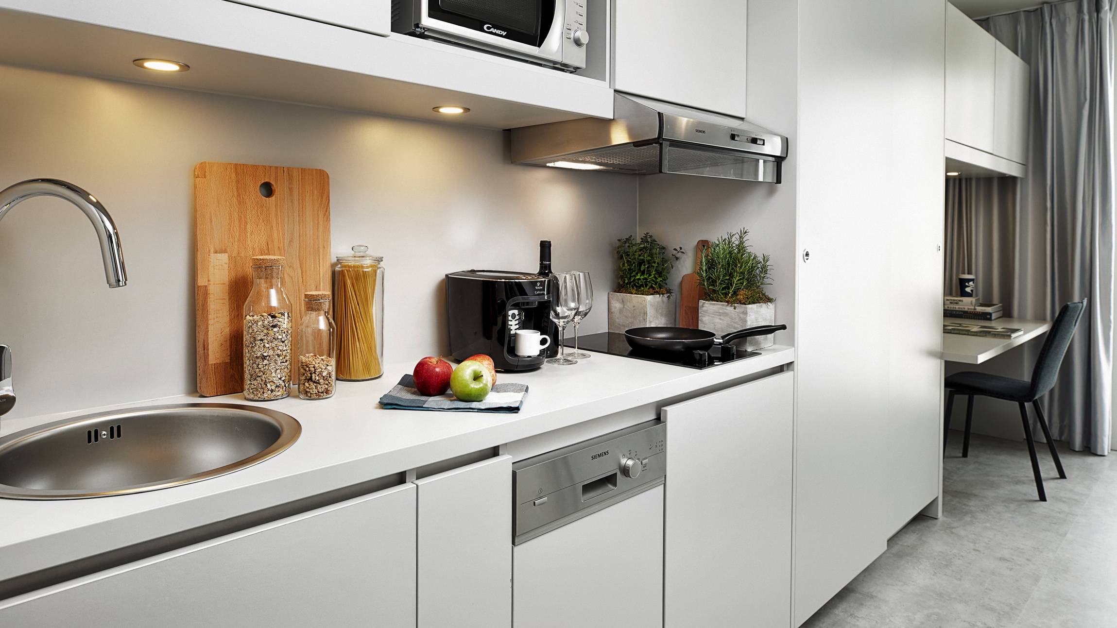Zona cucina dell'H.ome Serviced Apartments München Zona cucina dell'H.ome Serviced Apartments München