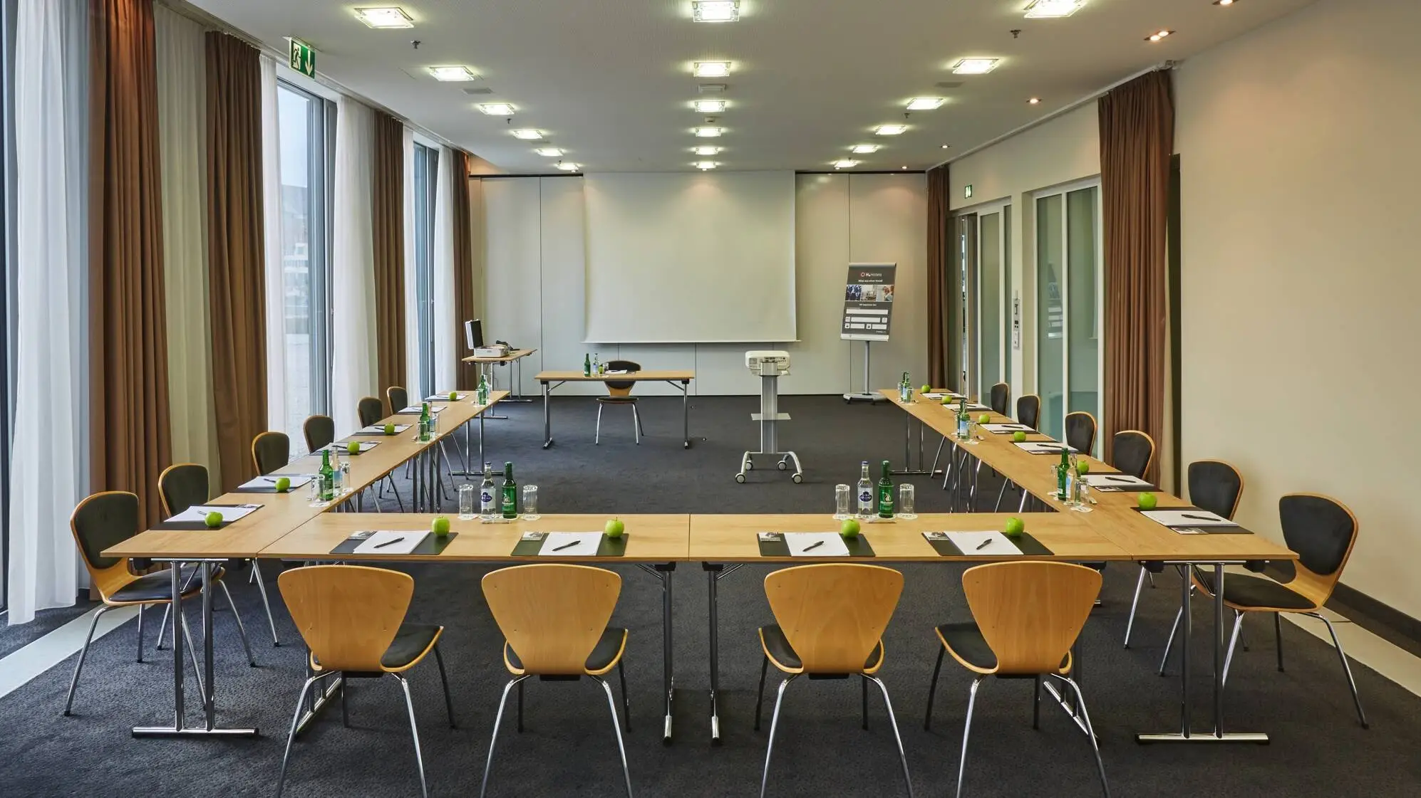 Conference room with U-shaped seating at the H4 Hotel Solothurn.