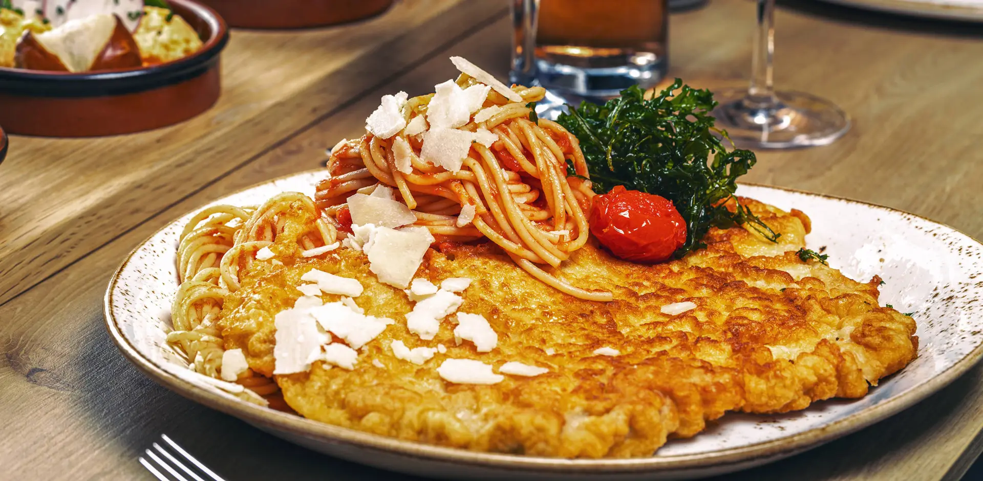 Milanese style Schnitzel - FRIEDRICHS Schnitzel-Bar - H-Hotels.com