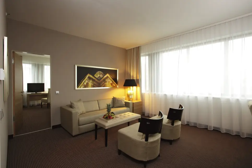 Living area in one of the suites at the H4 Hotel Berlin Alexanderplatz - Official website