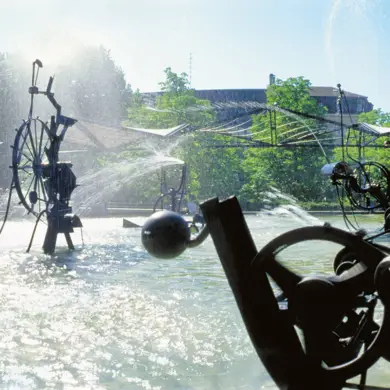 Sculptures in the water with fountains