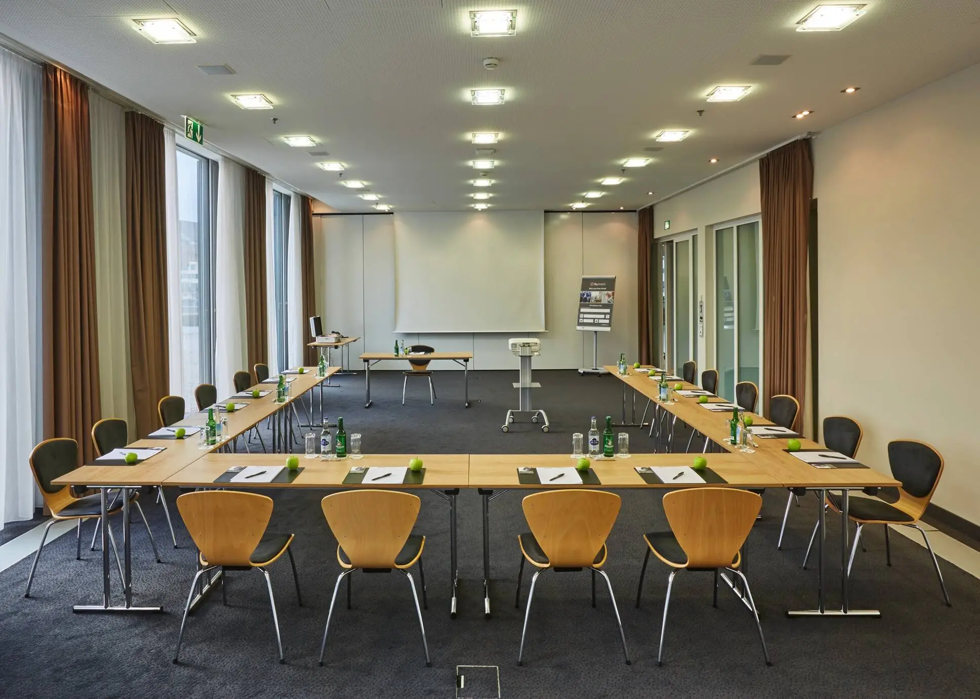 Conference room with U-shaped seating at the H4 Hotel Solothurn.