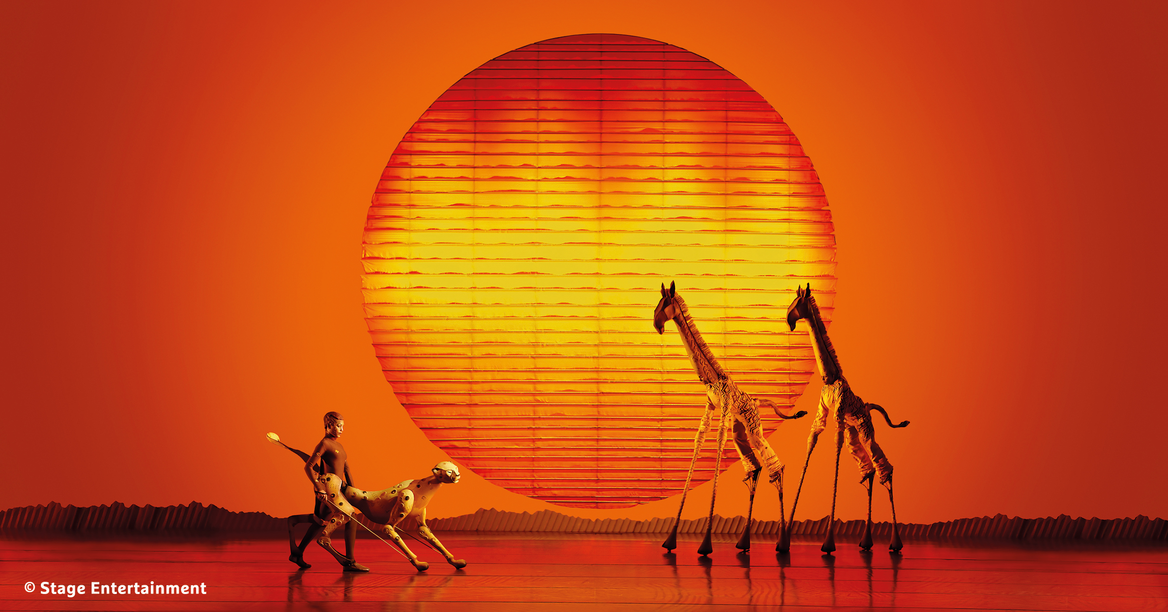 Bühnenbild im Musical Der König der Löwen - H-Hotels.com Bühnenbild im Musical Der König der Löwen - H-Hotels.com