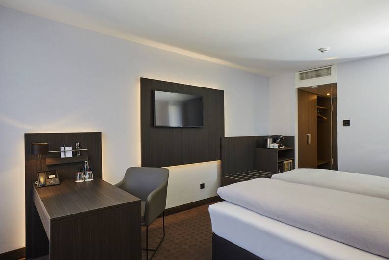 A comfortable hotelroom at the  H4 Hotel Residenzschloss Bayreuth - Official website