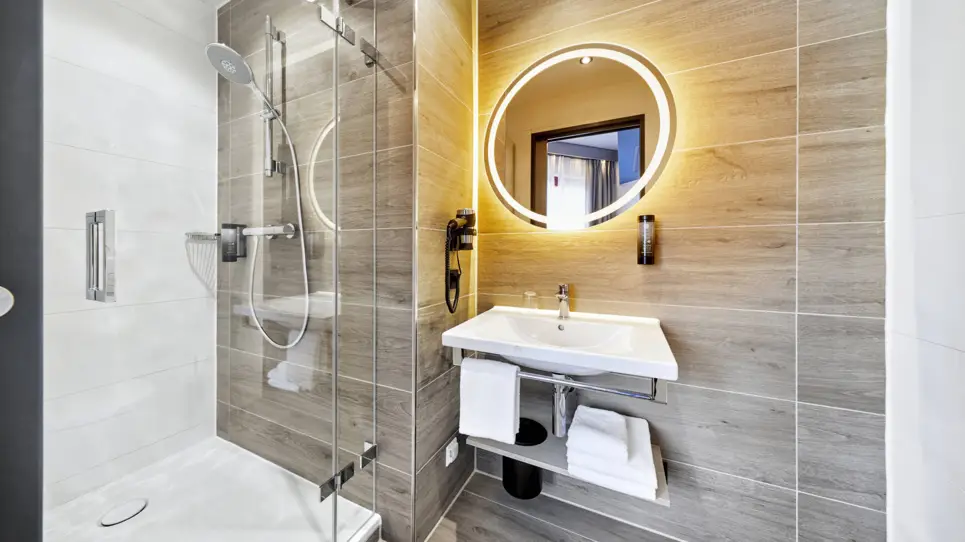 Camera singola comfort bagno  - H2 Hotel Düsseldorf Seestern - sito web ufficiale