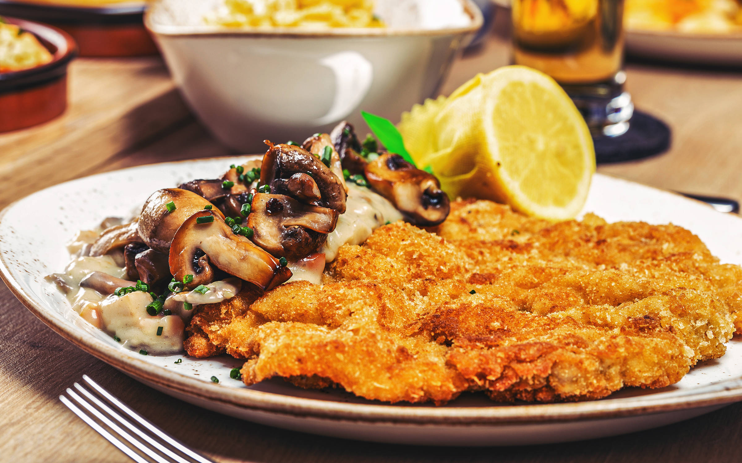 Jägerschnitzel of Landuro pig - FRIEDRICHS Schnitzel-Bar - H-Hotels.com Jägerschnitzel of Landuro pig - FRIEDRICHS Schnitzel-Bar - H-Hotels.com
